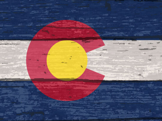 Colorado State Flag On Old Timber